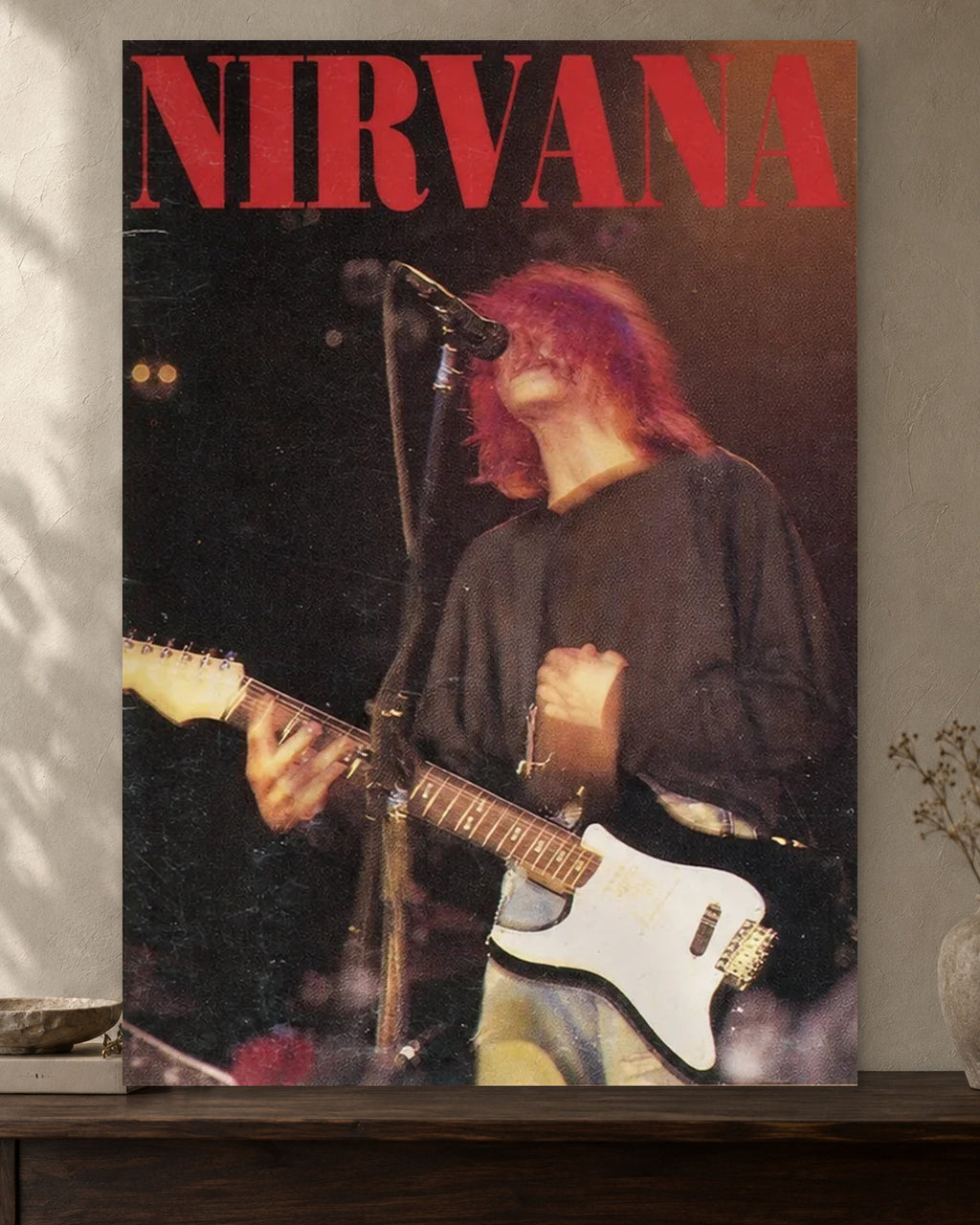 Kurt Cobain — Nirvana Live Poster poster artwork printed edge to edge on a warm neutral wall above a walnut console