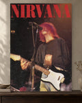 Kurt Cobain — Nirvana Live Poster poster artwork printed edge to edge on a warm neutral wall above a walnut console